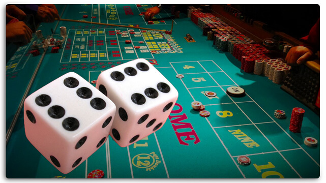 Craps Table and Two Dice Showing Six