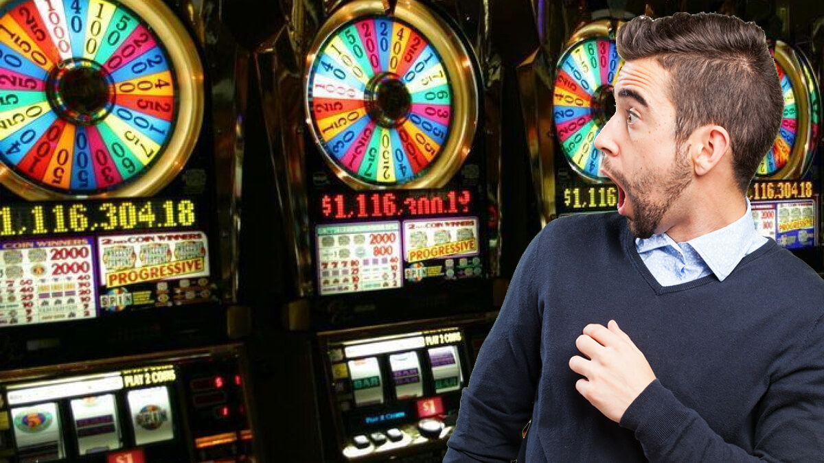 Progressive Slot Machines at a Casino - Man Showing an Impress Expression