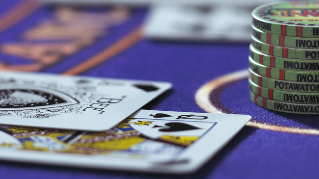 Cards and Casino Chips on Blackjack Table