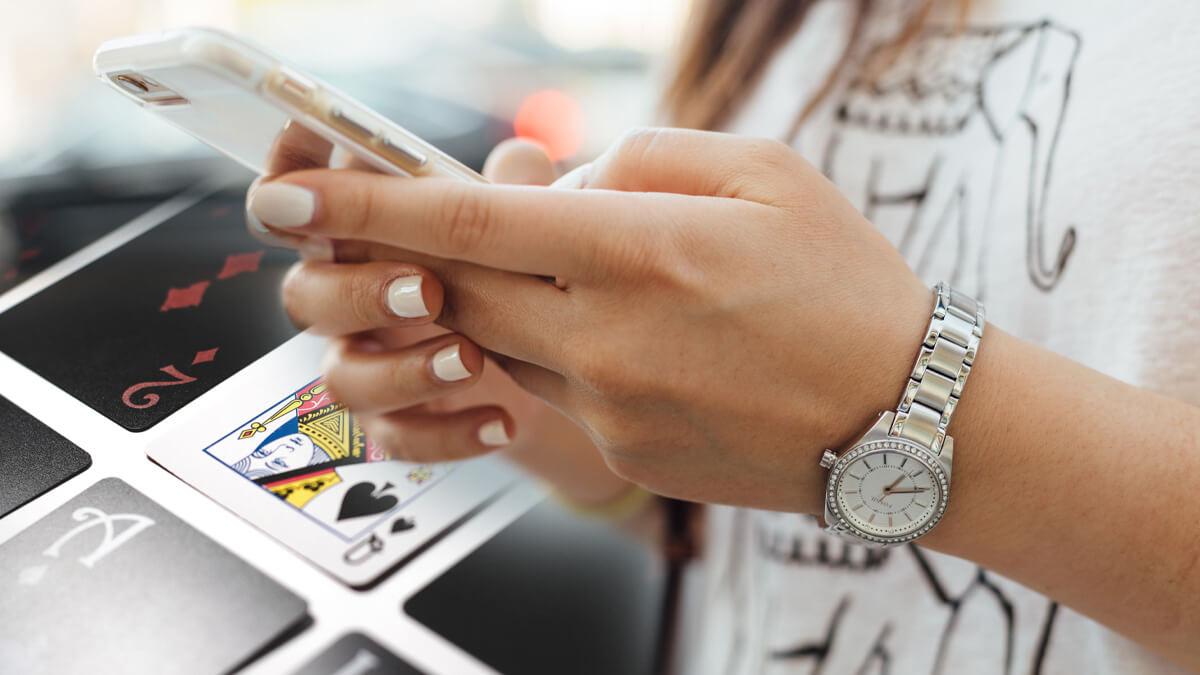 Poker Cards, Woman Using Cell Phone