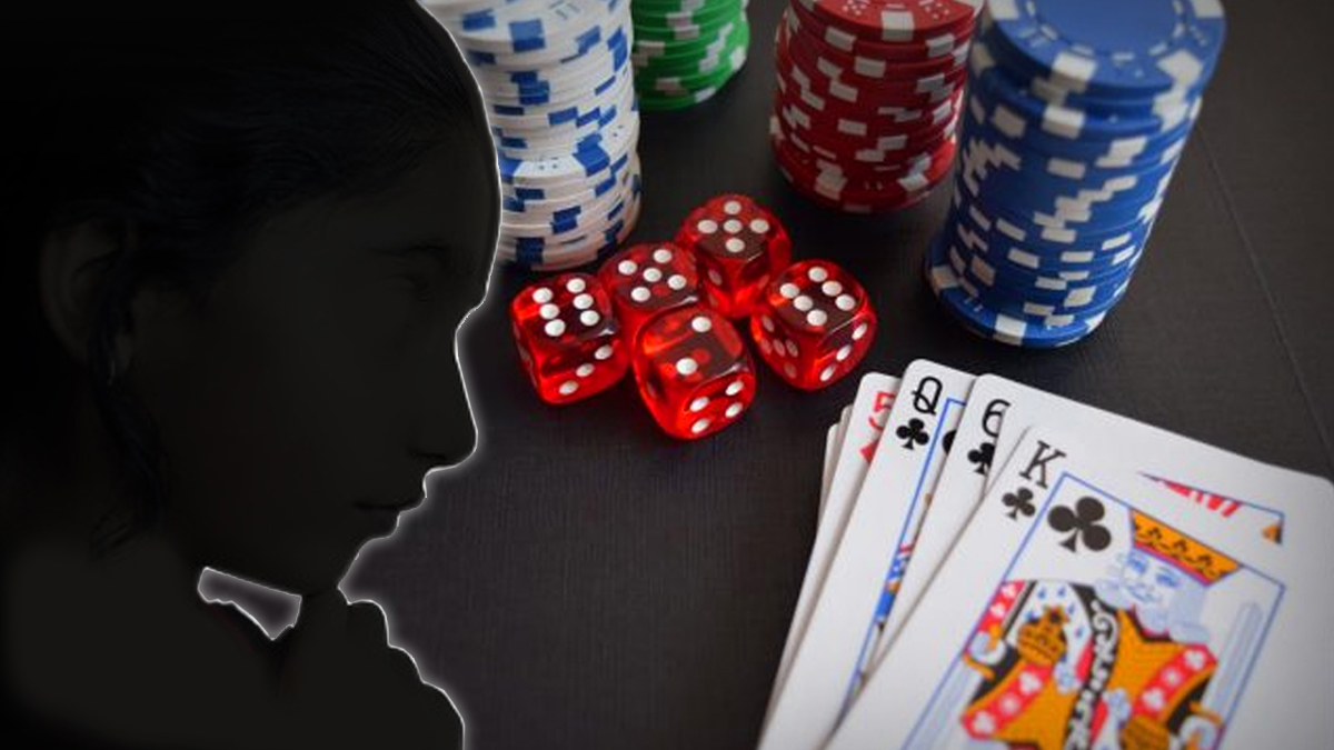 Silhouette of a Face Next to Cards Chips and Dice