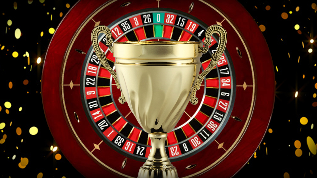 A Gold Trophy in Front of a Roulette Wheel and Confetti