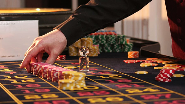 Roulette Table With Stacks of Chips on Top