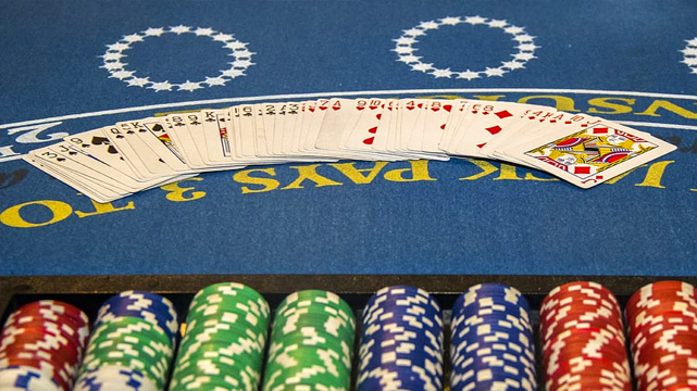 Blackjack Table With a Deck Fanned out Across It