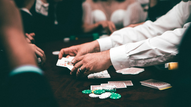 Closeup of Hands Dealing Cards