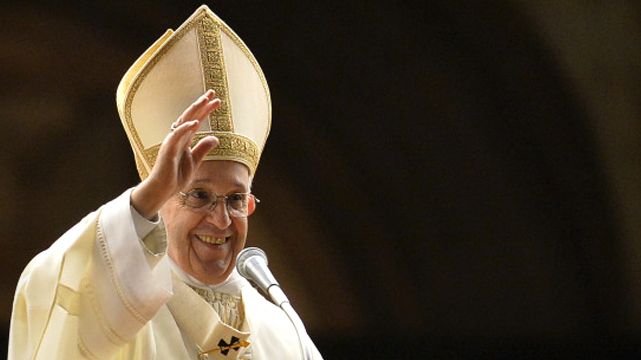 Pope Francis Waving From a Podium