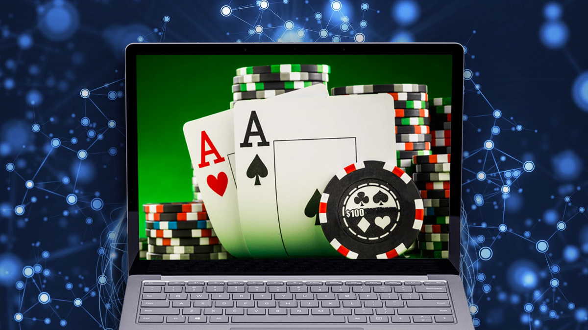 Laptop With Poker Graphic and a Tech Background