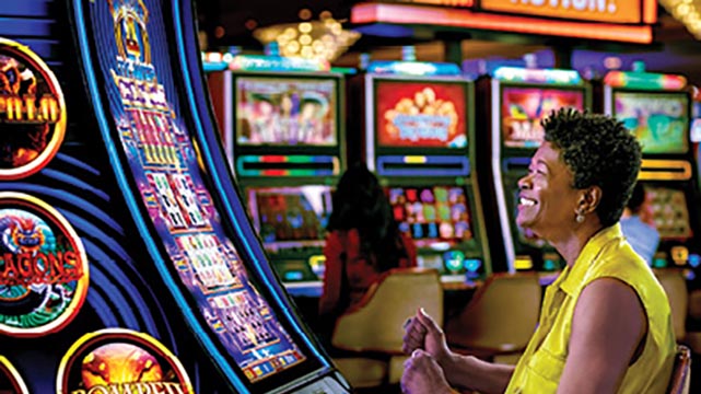 Woman Sitting at a Slot Machine