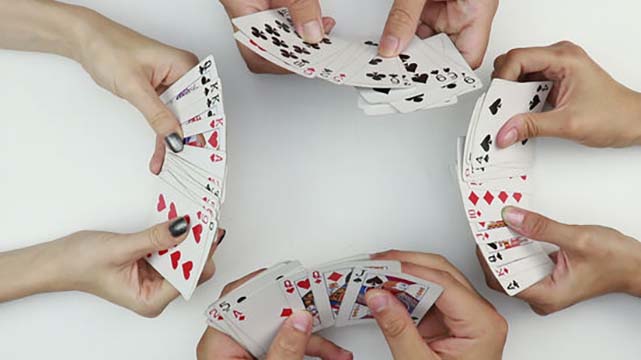 Four People Playing Spades