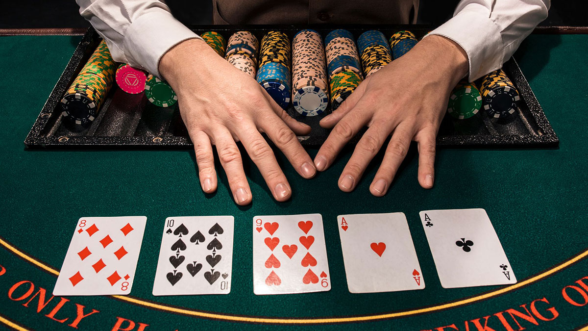 Dealer Dealing Cards At a Texas Hold'em Table